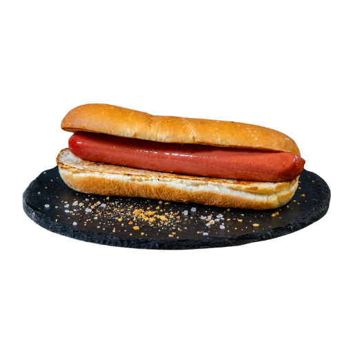 Perrito sencillo con salchicha en pan de hot dog, servido sobre una base de pizarra; Yogui Burger en Torrejón de Ardoz.
